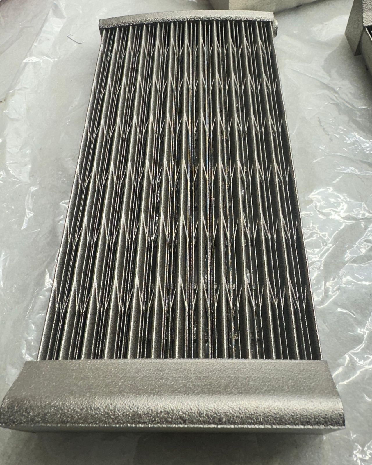 Finned part plated with electroless nickel